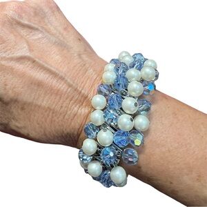 Adorable stretchy watch band type bracelet. Great Condition. Blue and pearl tone